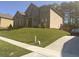 Attractive two-story brick home with a well-manicured lawn and paved driveway at 3798 Spring Place Ct, Loganville, GA 30052