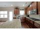 Modern kitchen with wooden cabinets, stainless steel appliances and granite countertops at 3798 Spring Place Ct, Loganville, GA 30052