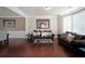 Comfortable living room featuring hardwood floors, neutral paint, and plenty of natural light at 3798 Spring Place Ct, Loganville, GA 30052