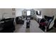 Bonus living room featuring a comfortable sectional, TV, and desk at 3798 Spring Place Ct, Loganville, GA 30052