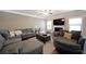 Open living room with wood floors, neutral decor, and comfortable seating options at 3798 Spring Place Ct, Loganville, GA 30052