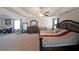 Spacious main bedroom with tray ceiling, ceiling fan, and carpeted flooring at 3798 Spring Place Ct, Loganville, GA 30052