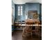 Stylish dining room featuring a brick fireplace, built-in bookshelves, and hardwood floors at 836 Dill Sw Ave, Atlanta, GA 30310