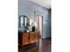 Entryway with a vintage-style dresser, mirror, lamp and hardwood floors adding character to the space at 836 Dill Sw Ave, Atlanta, GA 30310