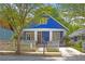 Charming blue two-story home with a inviting front porch and picket fence, perfect for relaxing outdoors at 836 Dill Sw Ave, Atlanta, GA 30310
