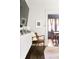 Cozy living room featuring a comfortable chair with view into the dining room at 836 Dill Sw Ave, Atlanta, GA 30310