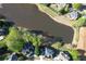 Aerial view of neighborhood and lake with lush greenery and mature trees at 870 Longstone Lndg, Alpharetta, GA 30022