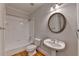 Bathroom with bathtub, toilet, sink and mirror with wooden floor at 870 Longstone Lndg, Alpharetta, GA 30022