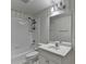 Well-lit bathroom with striped wallpaper, shower, and white vanity at 870 Longstone Lndg, Alpharetta, GA 30022