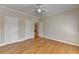 Spacious bedroom with hardwood floors, neutral paint, and ample closet space at 870 Longstone Lndg, Alpharetta, GA 30022