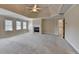 Large bedroom with a fireplace, large windows, and neutral carpeting at 870 Longstone Lndg, Alpharetta, GA 30022