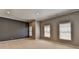 Spacious bedroom with neutral tones, large windows and baseboard trim at 870 Longstone Lndg, Alpharetta, GA 30022