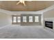 Expansive bedroom with a fireplace and ample natural light from several windows at 870 Longstone Lndg, Alpharetta, GA 30022