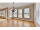 Dining room features natural light from the beautiful windows and chandelier at 870 Longstone Lndg, Alpharetta, GA 30022