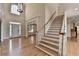 Elegant foyer features a staircase, hardwood floors, and plenty of natural light at 870 Longstone Lndg, Alpharetta, GA 30022