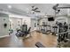 Community fitness center featuring modern equipment, mirrored walls, and ceiling fans at 870 Longstone Lndg, Alpharetta, GA 30022