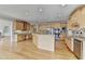 Kitchen features hardwood floors, a center island, stainless steel appliances, and lots of storage at 870 Longstone Lndg, Alpharetta, GA 30022