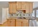Bright kitchen features stainless steel appliances, granite countertops, and tile backsplash at 870 Longstone Lndg, Alpharetta, GA 30022