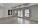 Open living room with hardwood floors, recessed lights and access to the outdoors at 870 Longstone Lndg, Alpharetta, GA 30022