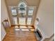 Spacious living room boasts tall ceilings, hardwood floors, and a beautiful fireplace at 870 Longstone Lndg, Alpharetta, GA 30022