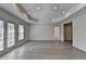 Living room with hardwood floors, recessed lighting and light-filled windows at 870 Longstone Lndg, Alpharetta, GA 30022