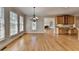 Open-concept living space with natural light and hardwood floors throughout at 870 Longstone Lndg, Alpharetta, GA 30022