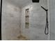 Modern walk-in shower with stylish tile, niche, and rainfall showerhead at 870 Longstone Lndg, Alpharetta, GA 30022