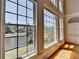 Lake view with tall windows allowing natural light to illuminate the living space at 870 Longstone Lndg, Alpharetta, GA 30022