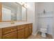 Bathroom with wood cabinets, neutral countertops, and an undermount sink at 1052 Pike Forest Ct, Lawrenceville, GA 30045