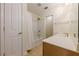 Bathroom with tub-shower, tile floor, and modern vanity with ample counter space at 1052 Pike Forest Ct, Lawrenceville, GA 30045