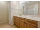 Bathroom featuring wood vanity with spacious counter and tub-shower with tile flooring at 1052 Pike Forest Ct, Lawrenceville, GA 30045