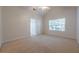 Bright bedroom with a large window and neutral carpet creates a serene atmosphere at 1052 Pike Forest Ct, Lawrenceville, GA 30045