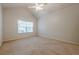 Spacious bedroom with a vaulted ceiling and large window providing ample natural light at 1052 Pike Forest Ct, Lawrenceville, GA 30045