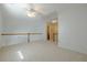 Open hallway showcasing connectivity and natural light within the home's upper level at 1052 Pike Forest Ct, Lawrenceville, GA 30045