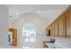 Eat-in kitchen has light-colored cabinets, stainless steel appliances, and arched window at 1052 Pike Forest Ct, Lawrenceville, GA 30045