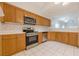 Bright kitchen featuring light-colored cabinets, stainless steel appliances, and a pass-through at 1052 Pike Forest Ct, Lawrenceville, GA 30045