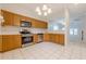 Bright eat-in kitchen features light-colored cabinets and stainless steel appliances at 1052 Pike Forest Ct, Lawrenceville, GA 30045