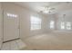 Bright living room features vaulted ceilings, large windows, and a fan at 1052 Pike Forest Ct, Lawrenceville, GA 30045