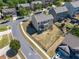 Aerial view of the property, showing the fenced backyard, patio, and proximity to neighborhood amenities at 1060 Crescent Ridge Dr, Buford, GA 30518