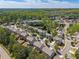 Aerial view of the neighborhood showcasing well-maintained homes, mature trees, and community amenities at 1060 Crescent Ridge Dr, Buford, GA 30518