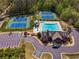 Overhead shot of the neighborhood recreation center that has a pool, tennis courts and clubhouse surrounded by mature trees at 1060 Crescent Ridge Dr, Buford, GA 30518