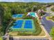 Community amenities including tennis courts and a swimming pool with slide, providing fun recreational options for residents at 1060 Crescent Ridge Dr, Buford, GA 30518