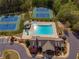 A view of the tennis courts and recreation center swimming pool that offers a water slide feature at 1060 Crescent Ridge Dr, Buford, GA 30518