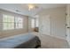 Bedroom featuring a ceiling fan, window and lots of natural light at 1060 Crescent Ridge Dr, Buford, GA 30518