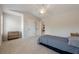 Bright bedroom featuring neutral walls, carpet, ceiling fan, and two doors at 1060 Crescent Ridge Dr, Buford, GA 30518