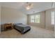 Bedroom featuring a ceiling fan, vaulted ceiling, and large window at 1060 Crescent Ridge Dr, Buford, GA 30518