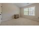 Bedroom with carpeting and large window that lets in lots of natural light at 1060 Crescent Ridge Dr, Buford, GA 30518