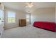Bedroom with vaulted ceiling, two windows, carpet, and ceiling fan at 1060 Crescent Ridge Dr, Buford, GA 30518