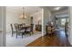 Elegant dining room with a wooden table, chandelier, and seamless access to living spaces at 1060 Crescent Ridge Dr, Buford, GA 30518
