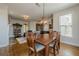 Dining room with wood floors, stylish light fixture, and abundant natural light at 1060 Crescent Ridge Dr, Buford, GA 30518